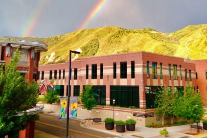 A rainbow is visible above the Garfiled County Branch Library and Morgridge Commons.
