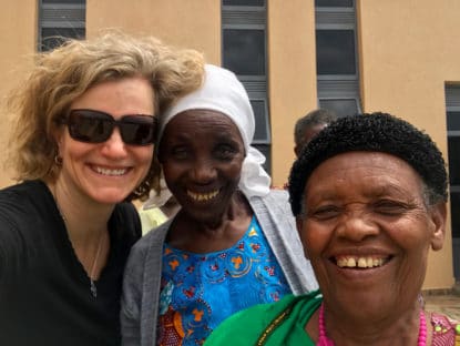 photo: CMC President Carrie Hauser with two African women