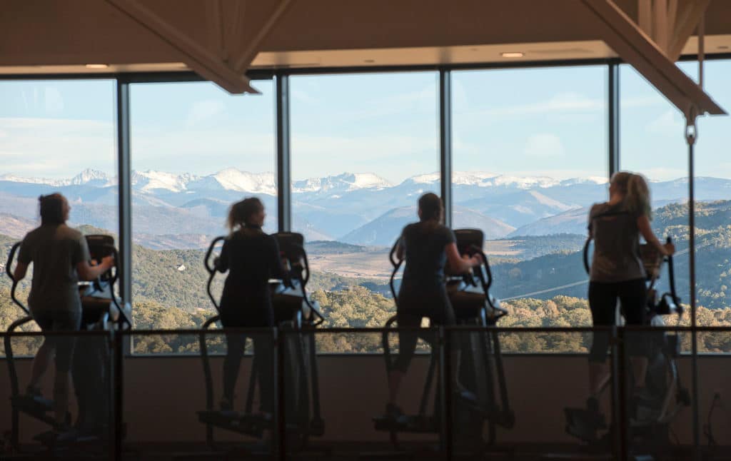 With an expansive view of Mt Sopris, students and community members work out on elliptical trainers in the CMC Spring Valley Outdoor Leadership Center & Field House.