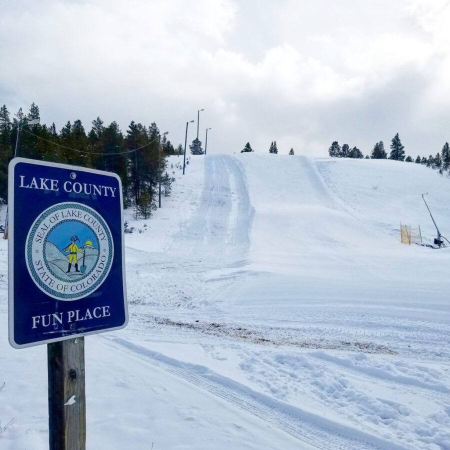 Cloud City Ski club hill at CMC Leadville with Lake County fun place sign