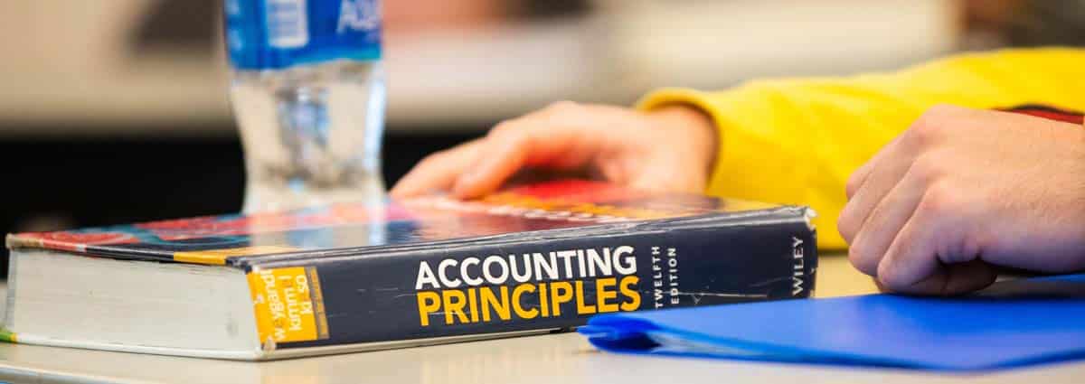 Accounting textbook on a desk.