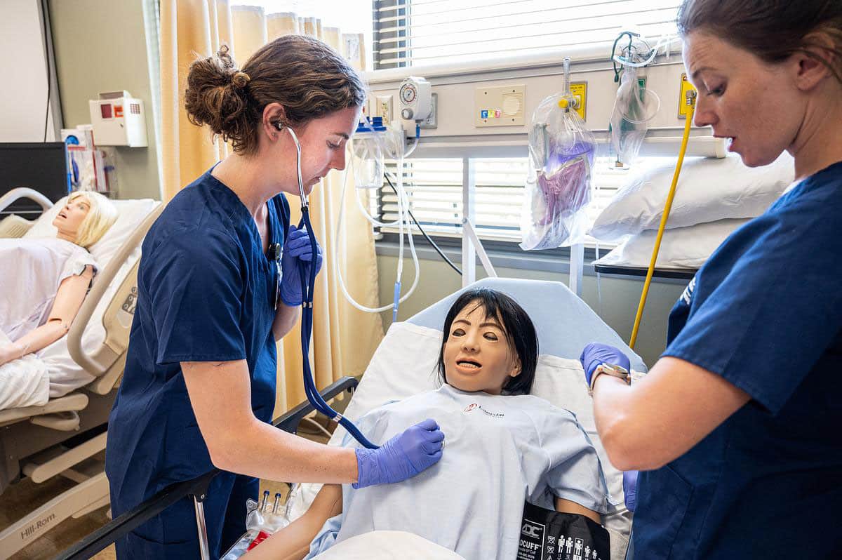 Two CMC nursing students work in the Nursing Simulation Lab at CMC Breckenridge.